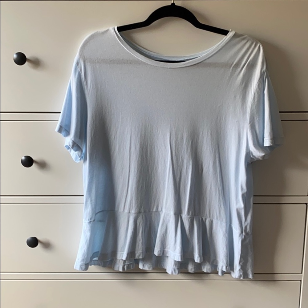 Baby blue top with a ruffle hem